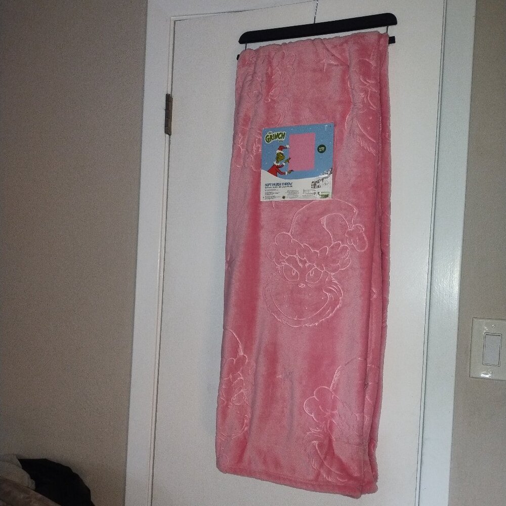 Pink Grinch embossed blanket